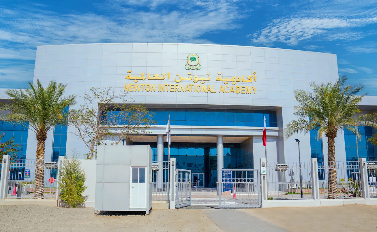 Outdoor facilities and school building at the Newton British School (NBS) Muraikh campus.