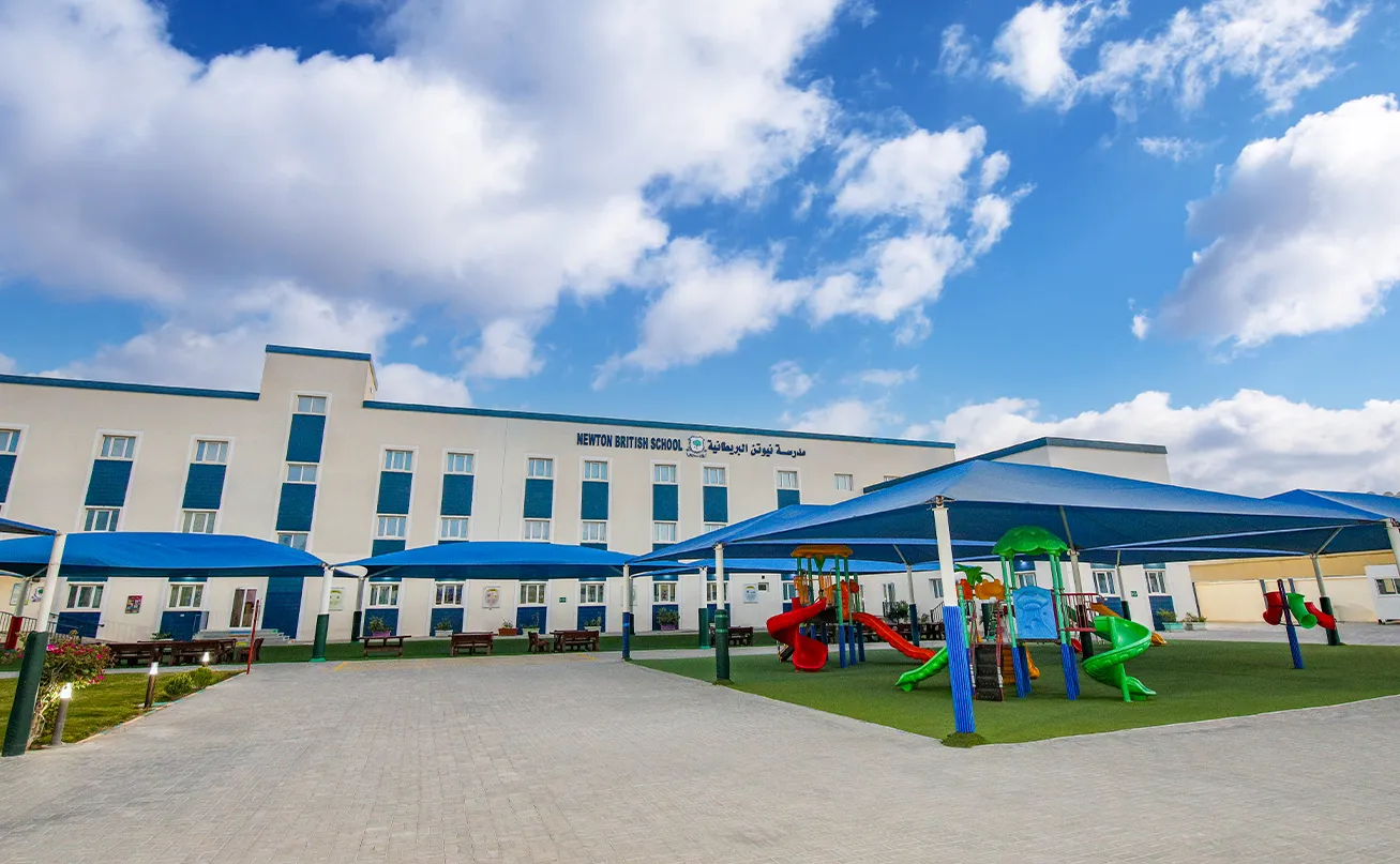 Outdoor facilities and school building at the Newton British School (NBS) Muraikh campus.